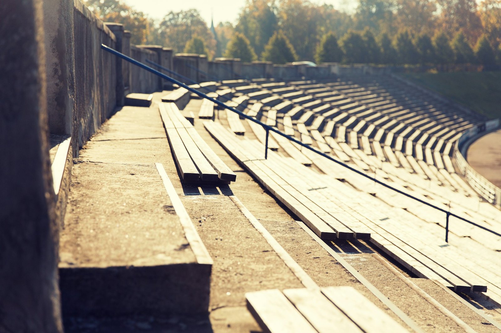 close up of bleachers with benches on stadium